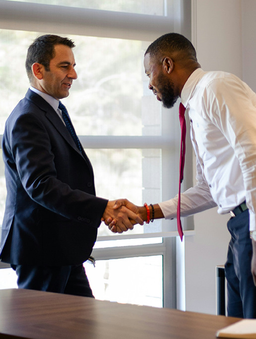 Successful hire for entry level staff accountant position - candidate and hiring manager shaking hands