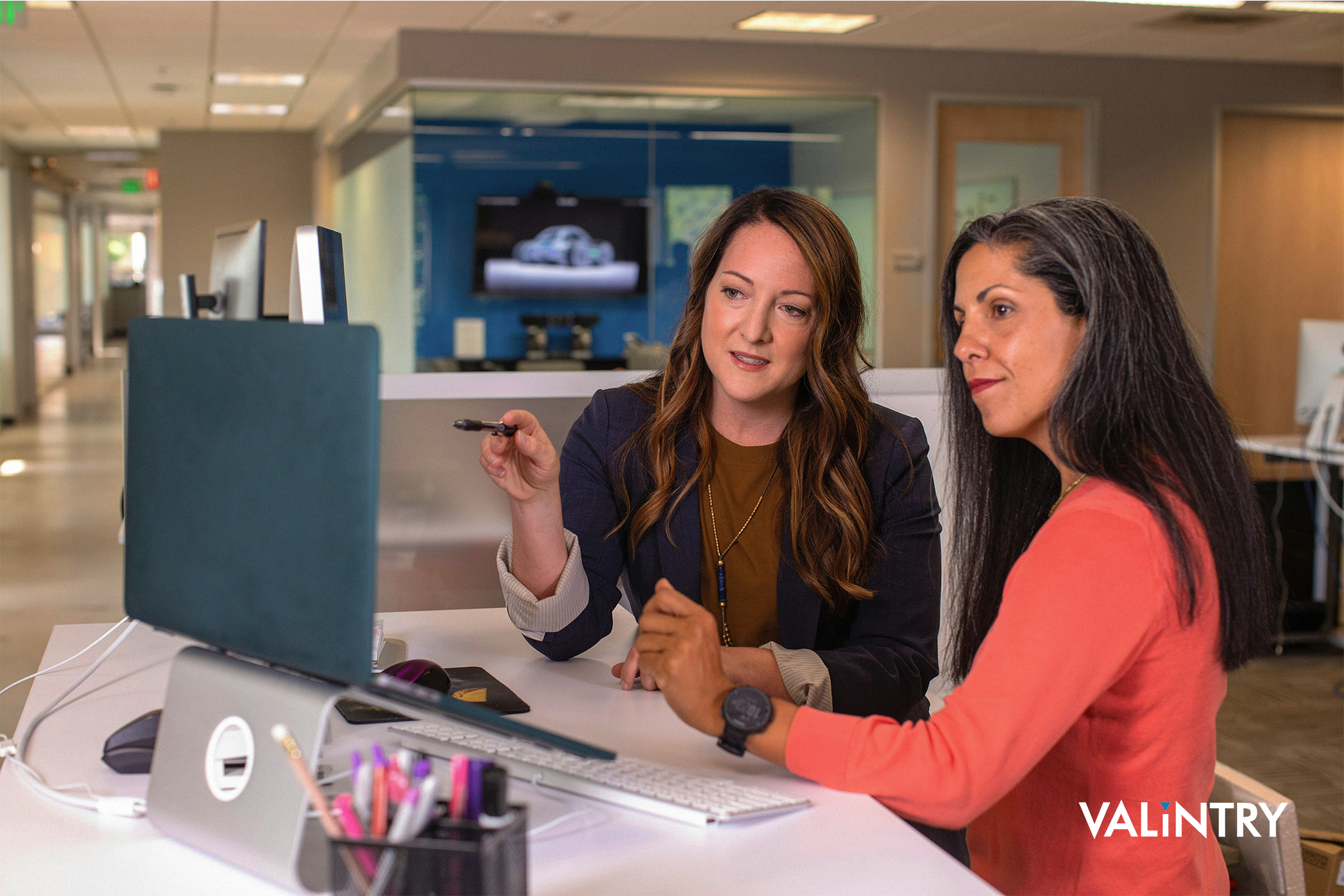 Two women review the IT candidates VALiNTRY has provided to them.